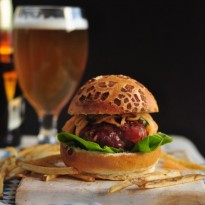 Prosciutto-Wrapped Burgers with Cantaloupe Slaw